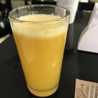 Good sized juice with menu of the day at Roots Veggie & Healthy Food in Barranquilla