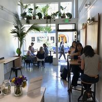A few small tables inside  at Palm Acai Cafe in Berkeley