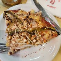 Yummy vegan pizza at Pizzería Güerrín in Buenos Aires