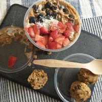 CocoNutter Coconut Bowl w/
Organic COCONUT Base (Coconut - Pudding Texture): Topped with STRAWBERRY, BLUEBERRY, Organic COCONUT FLAKES, and Pure ALMOND butter + VEGAN energy balls at The Juice House in New Providence