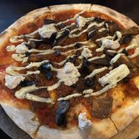 Pizza - toppings include mushroom, eggplant, caramelised onion, basil mayo and nut ricotta   at Moon Under Water in Christchurch