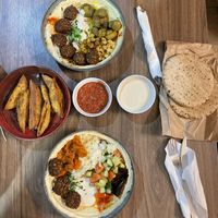 Complete (top) and salad (bottom) hummus bowls, za’atar sticks (left)  at Hummus Bar - Wesselényi in Budapest