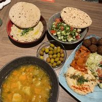 Babaganoush + Arabic Salad + Couscous Soup + Olives + Falafel Plate  at Hummus Bar - Wesselényi in Budapest