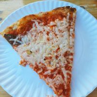 A slice of vegan pizza with Daiya cheese. at Umberto's in Sayville