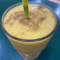 Mango, banana, coconut, cinnamon and nutmeg smoothie custom made  at Snoogies Health Bar in Cairns