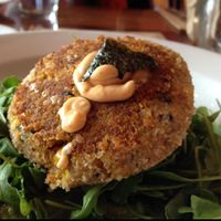 Sea Cake topped with a spicy aioli sauce at Real Food Daily in Santa Monica