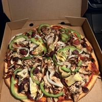 Vegetarian pizza without cheese and added artichoke - gluten free base available  at Rossini's Pizzaria in Mount Waverley