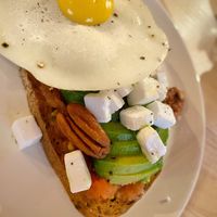 Avocado on gluten free toast with tomatoes, ‘feta’, and vegan egg! at Mukka Coffee in Mallorca
