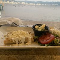 Not vegan, but on the menu it says vegetarian with the V on the top, that says also they can make it vegan. I said vegano, and it was with cheese and chicken. I returned it. at 100% Natural in Acapulco