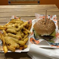 Delicious cheesey chips made with a cashew sauce and a very tasty classic burger the burger sauce was delicious.   at Herbivorous in Sheffield