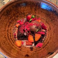 This vegan brownie with chocolate sorbet and peach slices was very delish ✨  at Amano in Auckland