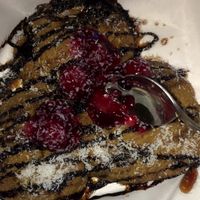Vegan cookie dough with chocolate sauce, caramel sauce, coconut chips and cherries 😋 at Creams Cafe in Birmingham