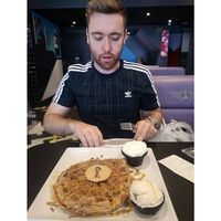 My partner with his Millionaires Waffle. #Veganuary at Creams Cafe in Blackpool
