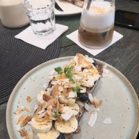 Vegan Almond butter toast with banana and coconut at Me Kolonaki in Athens