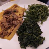 Polenta with funghi, spinach and rocket salad 🧆 at La Perla  in Cortina D Ampezzo