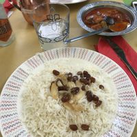 Basmati rice w/ almonds and raisins + veggies ragout  at Kirkuk Kaffe in Turin