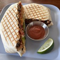 Vegan crunch wrap with hot sauce   at Simple Cafe in Asheville