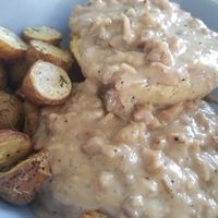 Vegan biscuits and gravy with herb potatoes (weekend special) at Simple Cafe in Asheville
