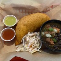 Vegan restaurant week special: giant empanada with vegan carnitas and beans rancheros   at Monse's Pupuseria in Colorado Springs