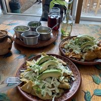 Chilaquiles verdes & rojos - with 2 salsas lime & onion & cilantro   at Aguacate Limon in Tulum