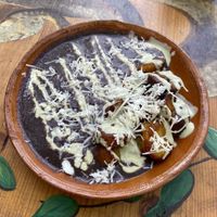 Fried plantain with black beans, tofu cream and vegan cheese   at Aguacate Limon in Tulum