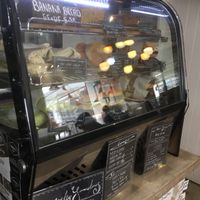 Food display (with reflection from the groovy lighting) at Mostly Sometimes in Fremantle