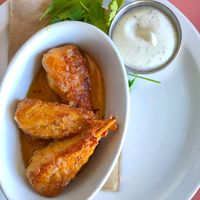 Wings with surprisingly delicious garlic sauce at The Burrow in Vancouver
