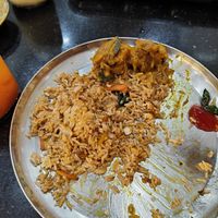 More-than-half eaten fried rice with soya chicken. at Vinny Jeyaa Banana Leaf Curry House in Kuala Lumpur