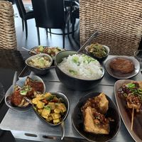 The vegan rice table with lots of small dishes, all of them incredibly delicious. at Rumah Makan Melati in Amersfoort