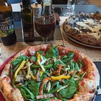Vegetable pizza with vegan cheese at Peruzza in Ljubljana