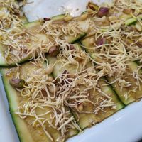 Zucchini carpaccio with peanuts, pistachios and smoked tofu 🥜 at Dalmatino in Hvar