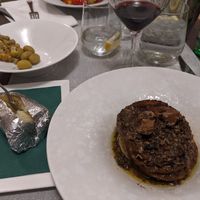 Truffle seitan mignon, a jacket potato, and local wine and olives at Dalmatino in Hvar
