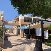 From street level its on the first floor and their are steps around to the right hand side with the chair lift, and behind the restaurant near the spar at Wanderlust Garden in Mallorca