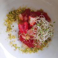 Acompañamiento vegano para salmorejo: brotes de soja, frutos rojos, tomate y pistachos at El Cabo in Carboneras