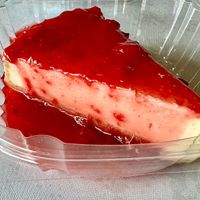 Vegan cheesecake with fruit topping 🍒   at Loving Hut in Cincinnati