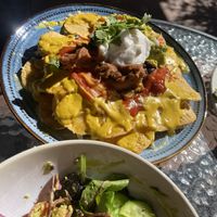 Nachos loaded with beans, refried beans, melted cheese, cheese sauce, guacamole AND sour cream!  at Vegalicious in Ettalong Beach