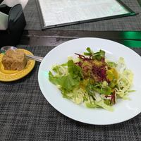 Salada e fatia de bolo de churros at Espaço VHMOR in Sao Paulo