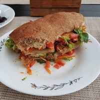 Sanduíche com tofu, tomate, cenoura e folhas verdes. at Espaço VHMOR in Sao Paulo