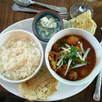 Vegan Aloo Ghobi curry with raita and rice at The Dragonfly in Dumfries