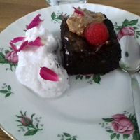 Vegan chocolate brownie with coconut cream at The Dragonfly in Dumfries