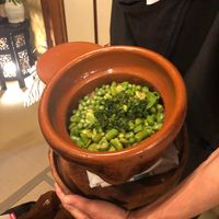 Rice with beans and parsley cooked in an earthenware pot at Chakura in Sakaishi