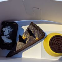 Coconut cherry chocolate cake (left), chocolate ganache, and lemon cake (right) at Aurora Sweets in Korcula