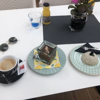 Oat mylk coffee, peanut butter & choc mousse and coconut cake. at Aurora Sweets in Korcula