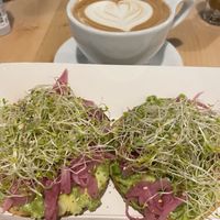 Mocha and bagel with avocado, pickled onions and sprouts  at The Bagel Mill in Petaluma