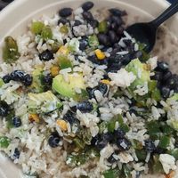 Veggie Taco bowl w/coconut rice without the cheese, it was good but very few veggies. Nothing too exciting but good for travelers that ate very little all day at Shaka Taco in Surf City