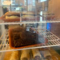 Cakes and sausage rolls at Monstera Canteen in Luton