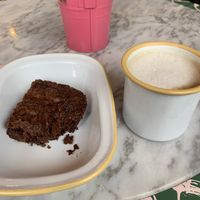 Brownie and coffee.  at Monstera Canteen in Luton