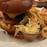 Cali Burger with coleslaw and regular fries 🌱  at Mighty Wieners  in Bournemouth