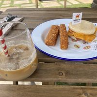 mighty muff with tofu egg, bacon and baconnaise - hash browns come with - iced latte  at Mighty Wieners  in Bournemouth