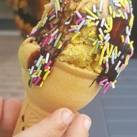 Salted caramel ice cream, with chocolate sauce and rainbow sprinkles at Cadwaladers - Mermaid Quay in Cardiff